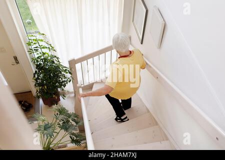 high angle view of woman on stairs Stock Photo