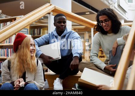 Students learning together in library Stock Photo