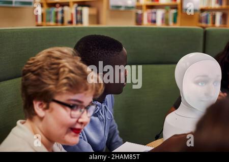 Young man sitting in library Stock Photo