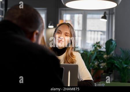 Woman talking in the office Stock Photo