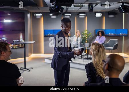 TV show host interviewing audience member Stock Photo