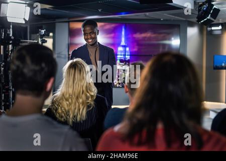 TV show host interviewing audience member Stock Photo