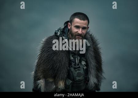 Hunter in mountains looking at camera Stock Photo