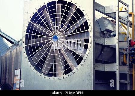 Industrial fan turbine background. Refrigeration temperature conditioning system. Air conditioner condenser fan units battery set climate control. Stock Photo