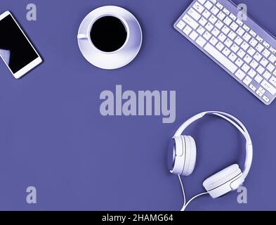 Flat layout on very peri lavender background. Horizontal photo. Composition concept online conference, desktop, office work and training, concept bloging, online education. Stock Photo