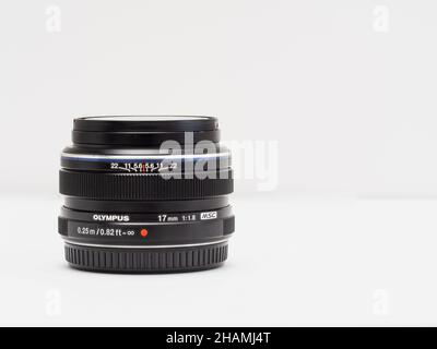 Close up of an Olympus Micro four thirds 17mm f1.8 prime camera lens in black Stock Photo