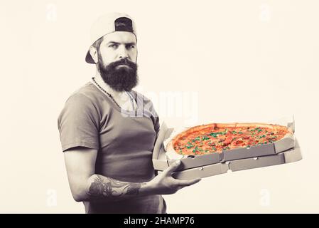 Crazy dizza delivery man holding pizza box. Stock Photo