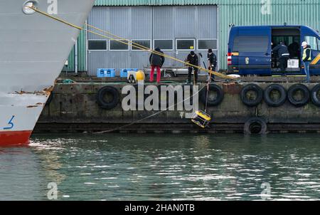 Personnel from the Swedish Coast Guard use an underwater drone (ROV) to investigate the damaged ship Scot Carrier in the port of Ystad, Sweden December 14, 2021. Two cargo ships - the Danish Karin Hoej and the British Scot Carrier - collided in the Baltic sea between the Swedish south coast and the Danish island Bornholm on the night between Sunday and Monday. Karin Hoej capsized after the collision.  Photo: Johan Nilsson / TT kod 50090 Stock Photo