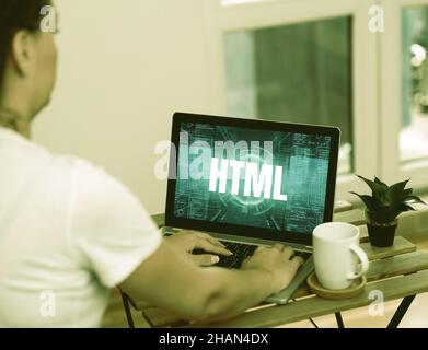 Inspiration showing sign Html. Business overview the lingua franca for publishing hypertext on the World Wide Web Woman Doing Work On Laptop Next To Stock Photo