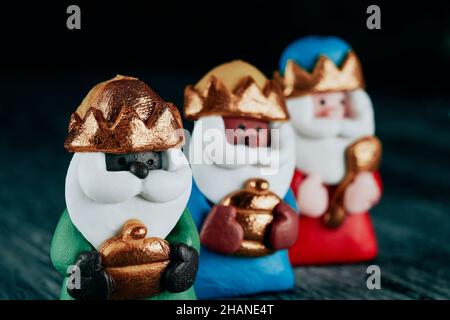 closeup of the three wise men, melchior, caspar and balthazar, on a gray rustic surface Stock Photo