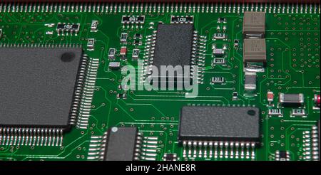 printed circuit board with active and passive surface mounted components close up Stock Photo