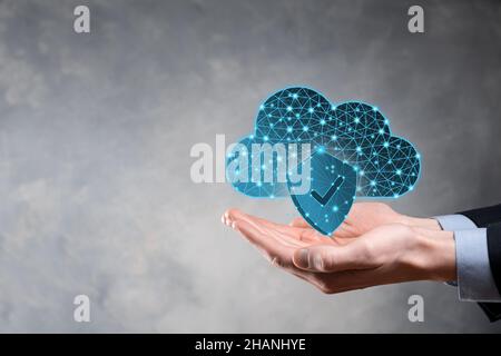 Cloud technology. Polygonal wireframe cloud storage sign with shield with a tick on dark blue. Cloud computing, big data center, future infrastructure Stock Photo