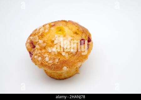 Cranberry and Orange Muffin with orange zest topped with sweet sugar pearls and redcurrants with Jaffa centre. Stock Photo