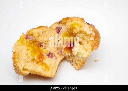 Cranberry and Orange Muffin with orange zest topped with sweet sugar pearls and redcurrants with Jaffa centre. Stock Photo