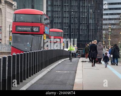 Cyclists are seen using the newly installed cycle lanes on Westminster bridge, London as the London Mayor Sadiq Khan tries to promote green travel Stock Photo