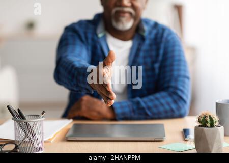 Unrecognizable Senior African Businessman Stretching Hand For Handshake In Office Stock Photo