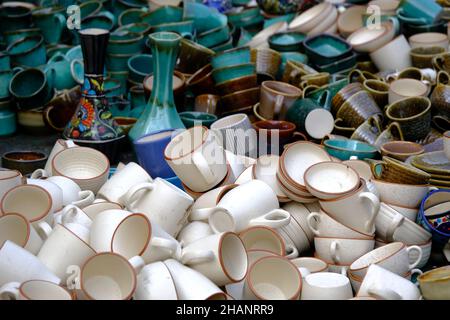 A street shop with oriental ceramics. Teapots, plates and bowls. Bowls, plates and tea cups in souvenir shop in Pune, Sale during Festival, Traditiona Stock Photo