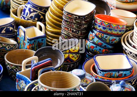 A street shop with oriental ceramics. Teapots, plates and bowls. Bowls, plates and tea cups in souvenir shop in Pune, Sale during Festival, Traditiona Stock Photo