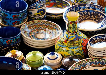 A street shop with oriental ceramics. Teapots, plates and bowls. Bowls, plates and tea cups in souvenir shop in Pune, Sale during Festival, Traditiona Stock Photo