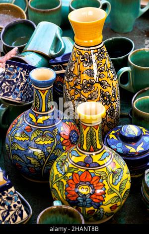 A street shop with oriental ceramics. Teapots, plates and bowls. Bowls, plates and tea cups in souvenir shop in Pune, Sale during Festival, Traditiona Stock Photo