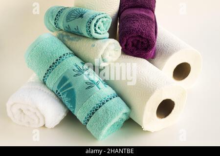 Clean face towels rolled up with paper towels on a white background Stock Photo