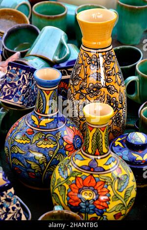 A street shop with oriental ceramics. Teapots, plates and bowls. Bowls, plates and tea cups in souvenir shop in Pune, Sale during Festival, Traditiona Stock Photo