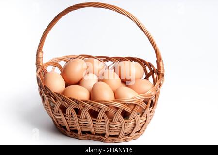 raw eggs in a basket isolated Stock Photo