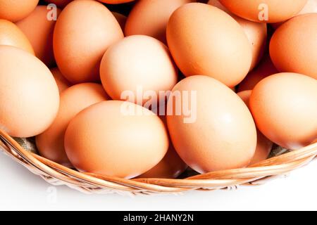 raw eggs in a basket isolated Stock Photo