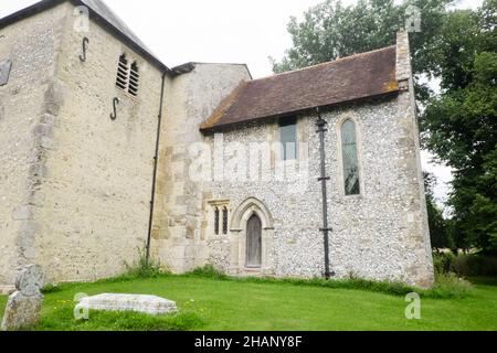 Ancient,old,Saxon,church,with,early Norman chancel arch,Church of St Mary,Stoughton Church,Stoughton,West,Sussex,West Sussex,England,English,GB,Great Britain,Britain,UK,United Kingdom,Europe,European,With gravestones as footpaths, and borders, Stock Photo