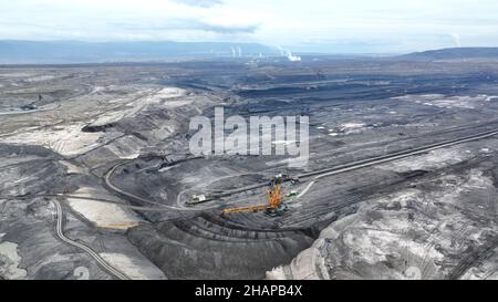 Brown coal opencast mine bucket wheel excavator giant giant Vrsany, aerial video shot view, open pit lignite heavy quarry, mining for power plants Stock Photo