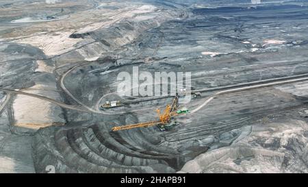 Brown coal opencast mine bucket wheel excavator giant giant Vrsany, aerial video shot view, open pit lignite heavy quarry, mining for power plants Stock Photo