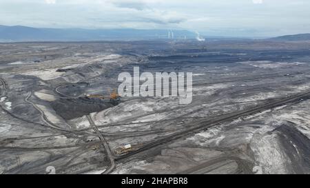 Brown coal opencast mine bucket wheel excavator giant giant Vrsany, aerial video shot view, open pit lignite heavy quarry, mining for power plants Stock Photo