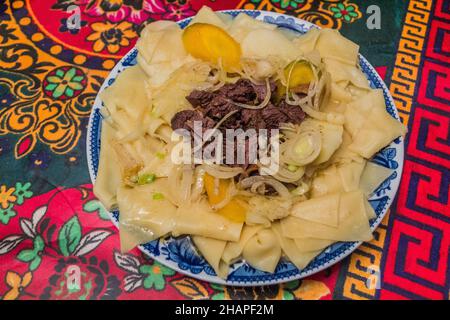 Beshbarmak, national dish among nomadic Turkic peoples in Central Asia Stock Photo