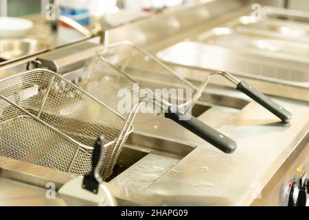 square basket sieve for frying in oil, top view Stock Photo