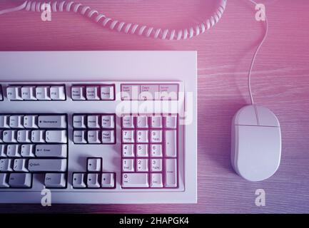 Retro computer keyboard& mouse in light leak Stock Photo