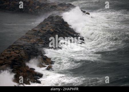 Dana Point, California, USA. 14th Dec, 2021. Stormy seas smash into the break water at Dana Point harbor under a high surf advisory, as wet weather comes to Orange county. Heavy rain has drenched Los Angeles County and Orange County and the Inland Empire, with the potential for flash flooding in some areas, authorities said. The heaviest rain had been absorbed in the San Fernando Valley and L.A. County mountains and foothills, with some areas already seeing upwards of three inches of rainfall according to the National Weather Service. Flash-flood watches were in effect in fire-burn scar are Stock Photo