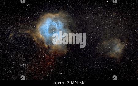 The Rosette Nebula (also known as Caldwell 49) is a large spherical H II region (circular in appearance) near one end of a giant molecular cloud Stock Photo