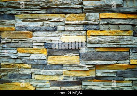 Grey & yellow brick wall background Stock Photo