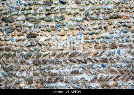 A section of the exterior of the north wall, believed to be early 11th century, of St Mary of the Assumption, Ufford, Suffolk Stock Photo