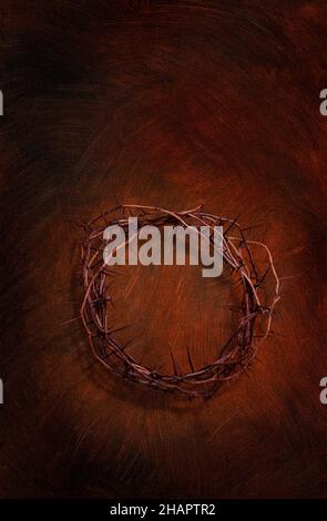 Crown of thorns on a dark red brown painted on canvas texture background Stock Photo