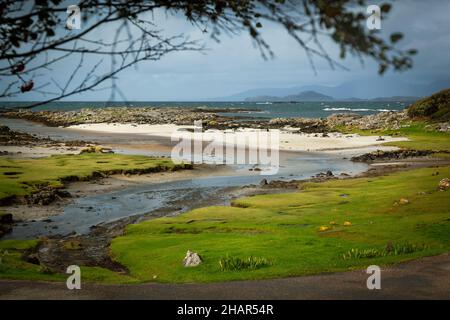The inlet and white sands beach of Portuairk, the most westerly settlement on the British mainland that has views of the Small Isles, West Scotland Stock Photo
