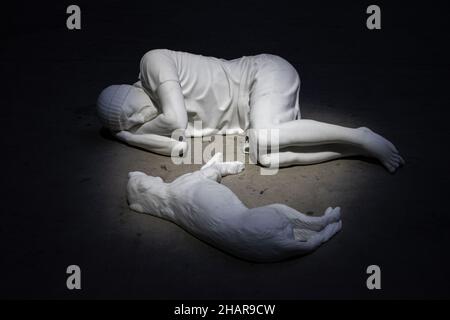 Hangar Bicoccca, Milan: view of Breath Ghosts Blind by Maurizio Cattelan, Carrara white marble sculpture of a person and a dog lying facing each other Stock Photo