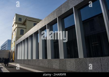 Milan, Italy: The Haunted House designed by Rem Koolhaas, covered with a layer of gold leaf, is one of the buildings of the Fondazione Prada Stock Photo