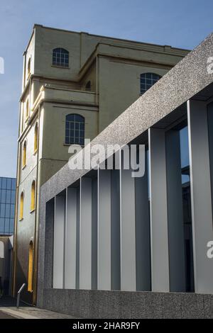 Milan, Italy: The Haunted House designed by Rem Koolhaas, covered with a layer of gold leaf, is one of the buildings of the Fondazione Prada Stock Photo