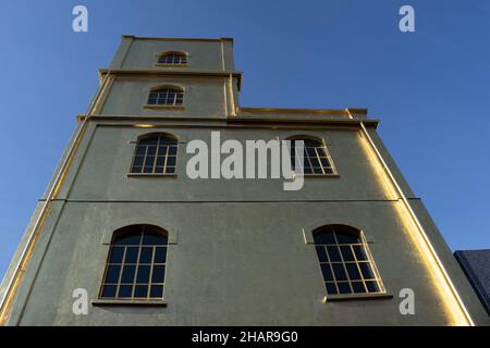Milan, Italy: The Haunted House designed by Rem Koolhaas, covered with a layer of gold leaf, is one of the buildings of the Fondazione Prada Stock Photo