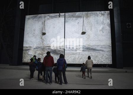 Milan, Italy: Visitors look at Alchemie (Alchemy), two canvases by Alnselm Kiefer, part of The Seven Heavenly Palaces, installation at Hangar Bicocca Stock Photo