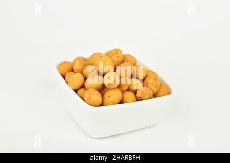 Coated Peanuts in Bowl Isolated on White Background Stock Photo