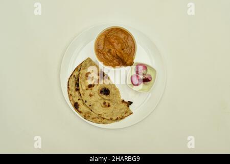 Butter Chicken with Roti in Plate isolated on White Background Stock Photo