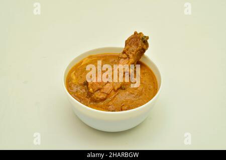 Butter Chicken in Bowl on White Background Stock Photo