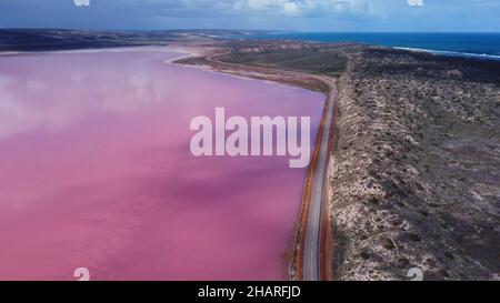 aerial view, to the south, of the pink water of hutt lagoon a green pygmy goose at marlgu billabong of parry lagoons nature reserve in the kimberley Stock Photo